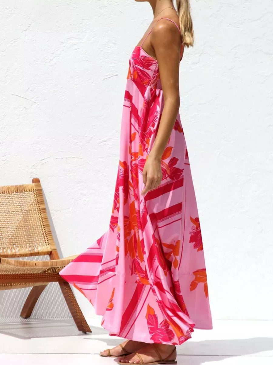 Maxi dress with spaghetti straps in a pink floral and stripe print.