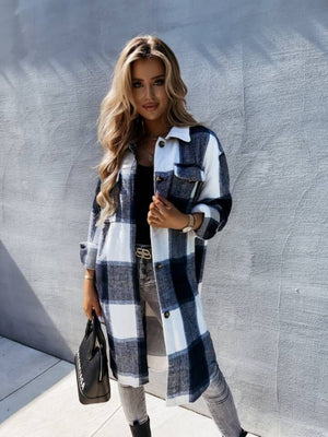 Checkered collar shirt jacket in black and white plaid, featuring button front and pockets.