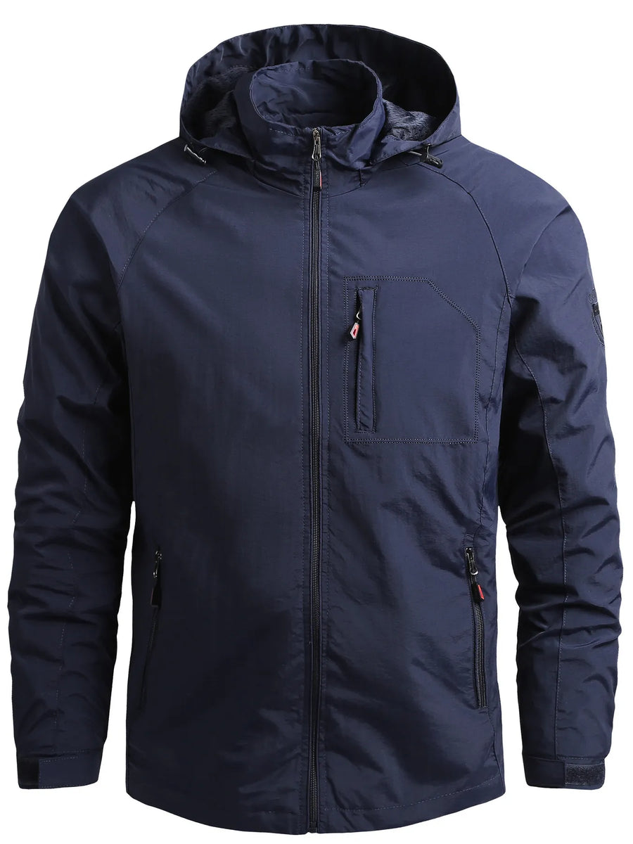Dark blue hooded windbreaker jacket with zip pockets and adjustable cuffs