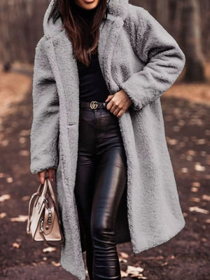 Longline teddy bear coat in gray with hood and button closure.