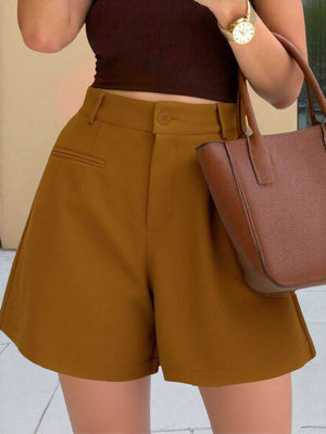Brown pleated high-waisted shorts with button closure and pocket detail.