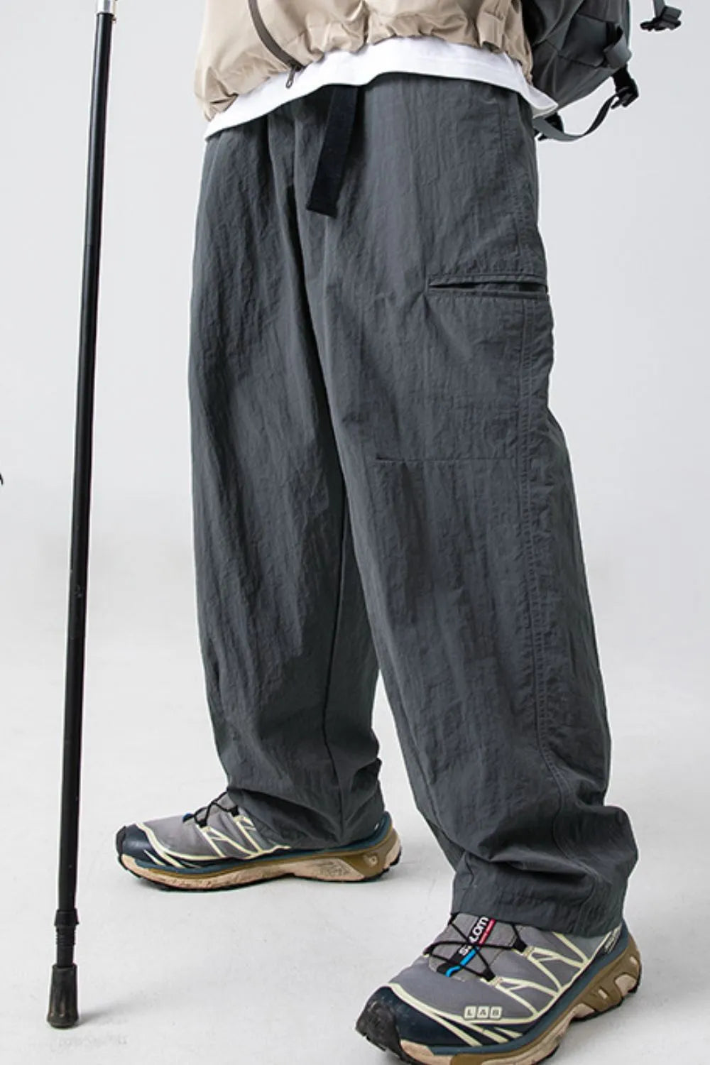 Dark gray technical fabric cargo pants with belt and pockets