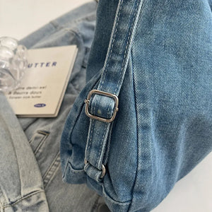 Denim hobo bag in medium wash with silver buckle detail and leatherette patch.