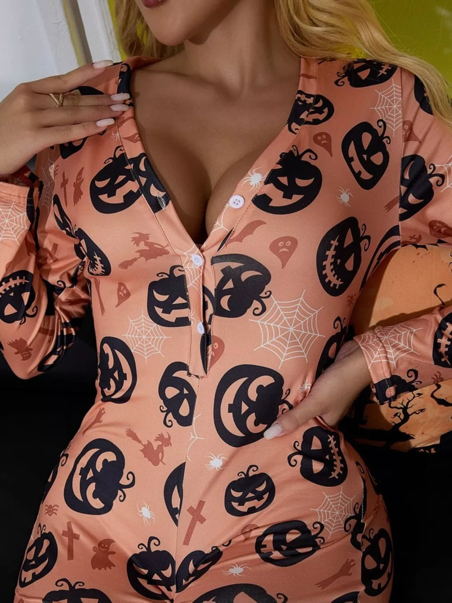 black romper featuring buttoned and pumpkin print