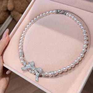 necklace in ivory featuring pearl embellishment and fitted fit