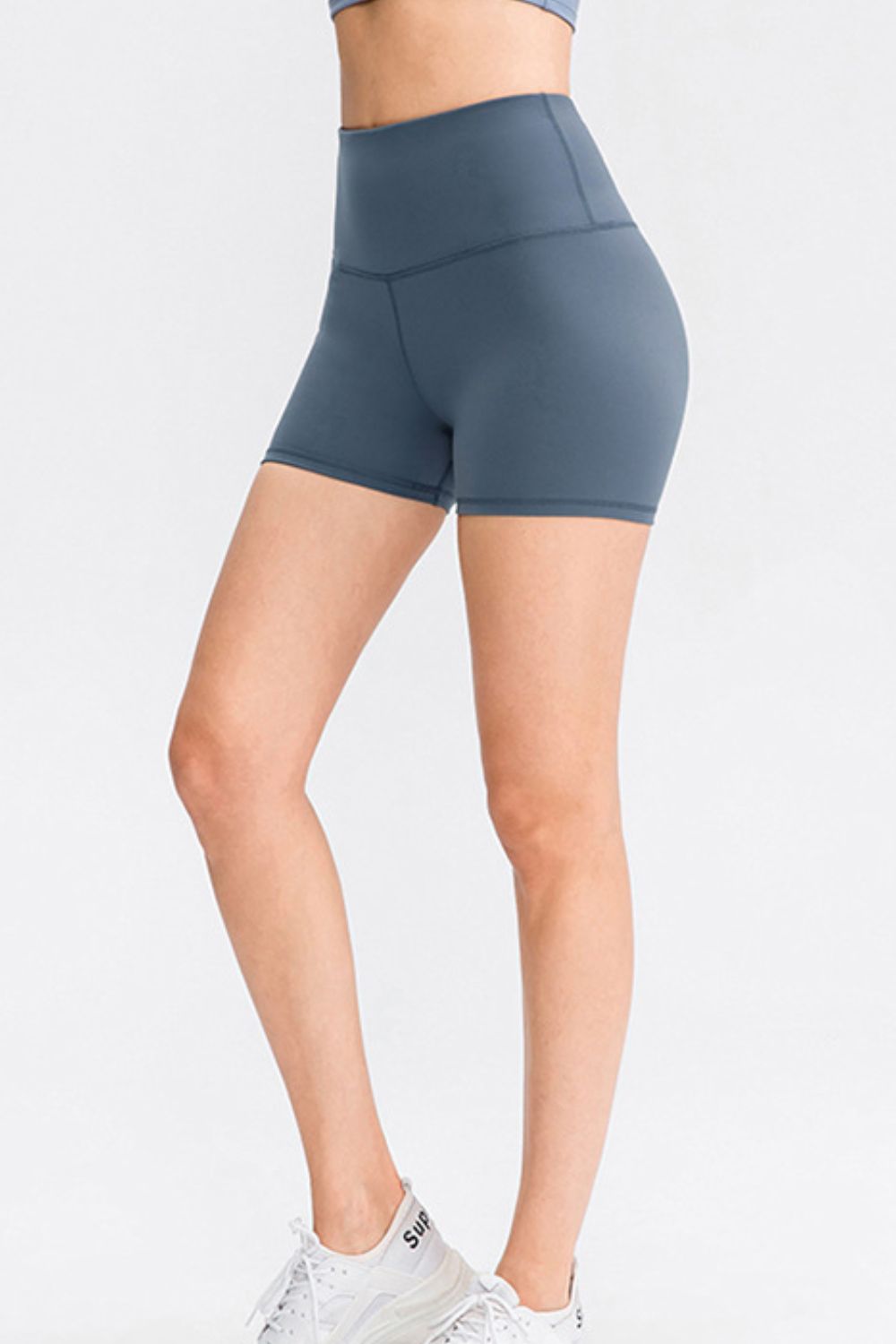 Sculpted Contour athletic shorts in Dusty Blue with a high waist and V-seam detail.