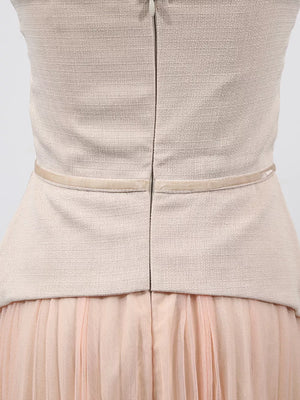 Embroidered tulle midi dress with sheer sleeves in beige and pink, featuring a textured bodice and pleated skirt.