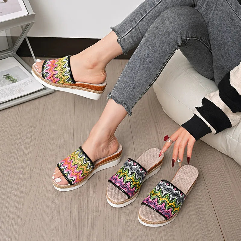 Zigzag embroidered espadrille platform slides with braided jute detail.