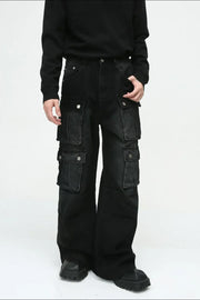 Dark denim wide-leg cargo pants with multiple utility pockets and silver button closures.