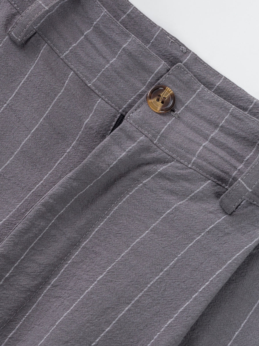Grey striped men's sweatpants with a button closure and textured fabric.