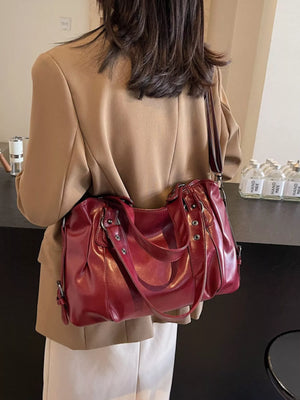Large vintage PU leather shoulder bag in wine red with double handles and silver hardware.