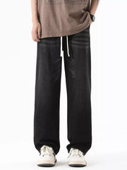 Black gray wide-leg jeans with drawstring and distressed details.