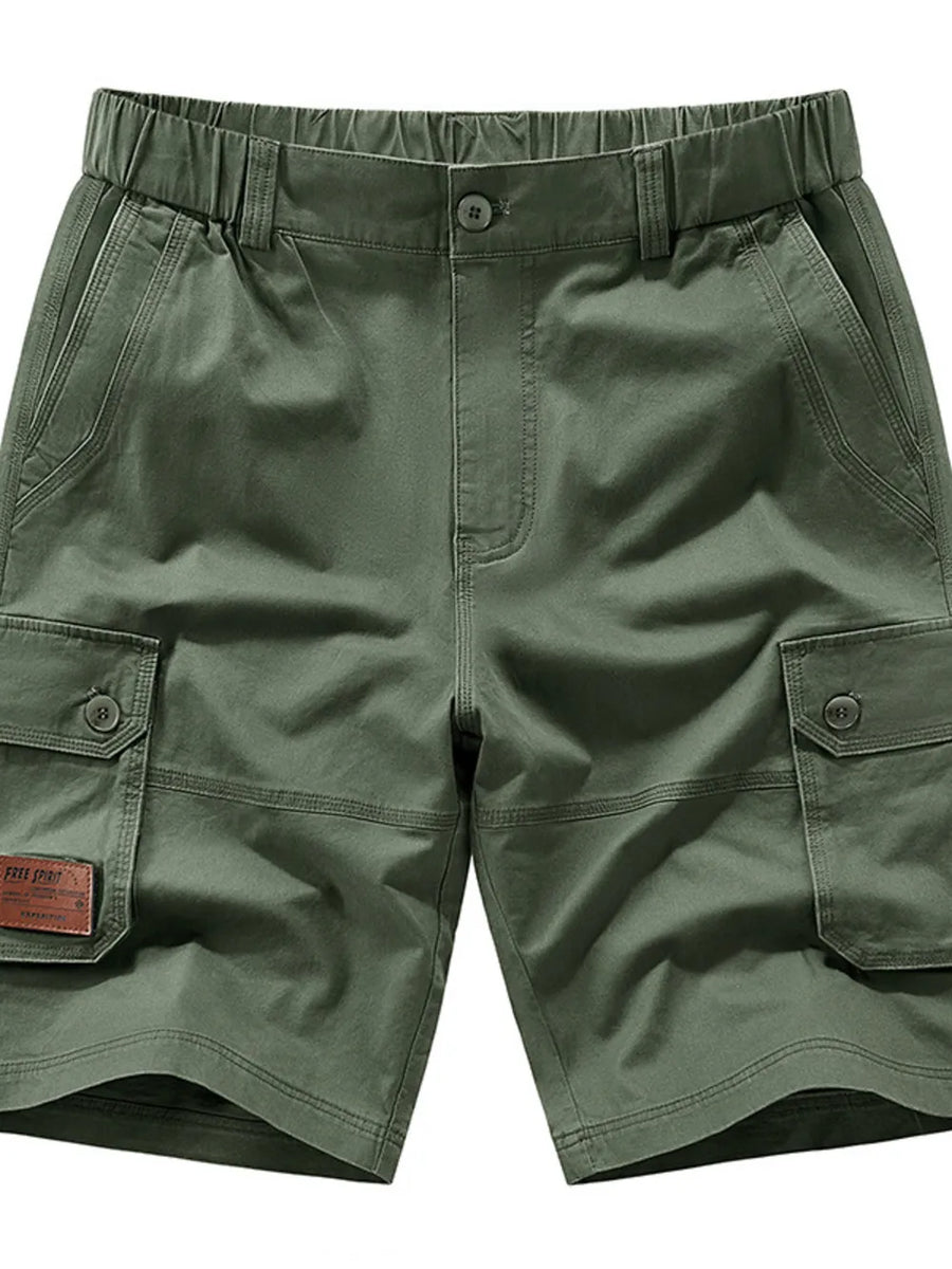 Military green chino shorts with elastic waist, button fly, and cargo pockets.