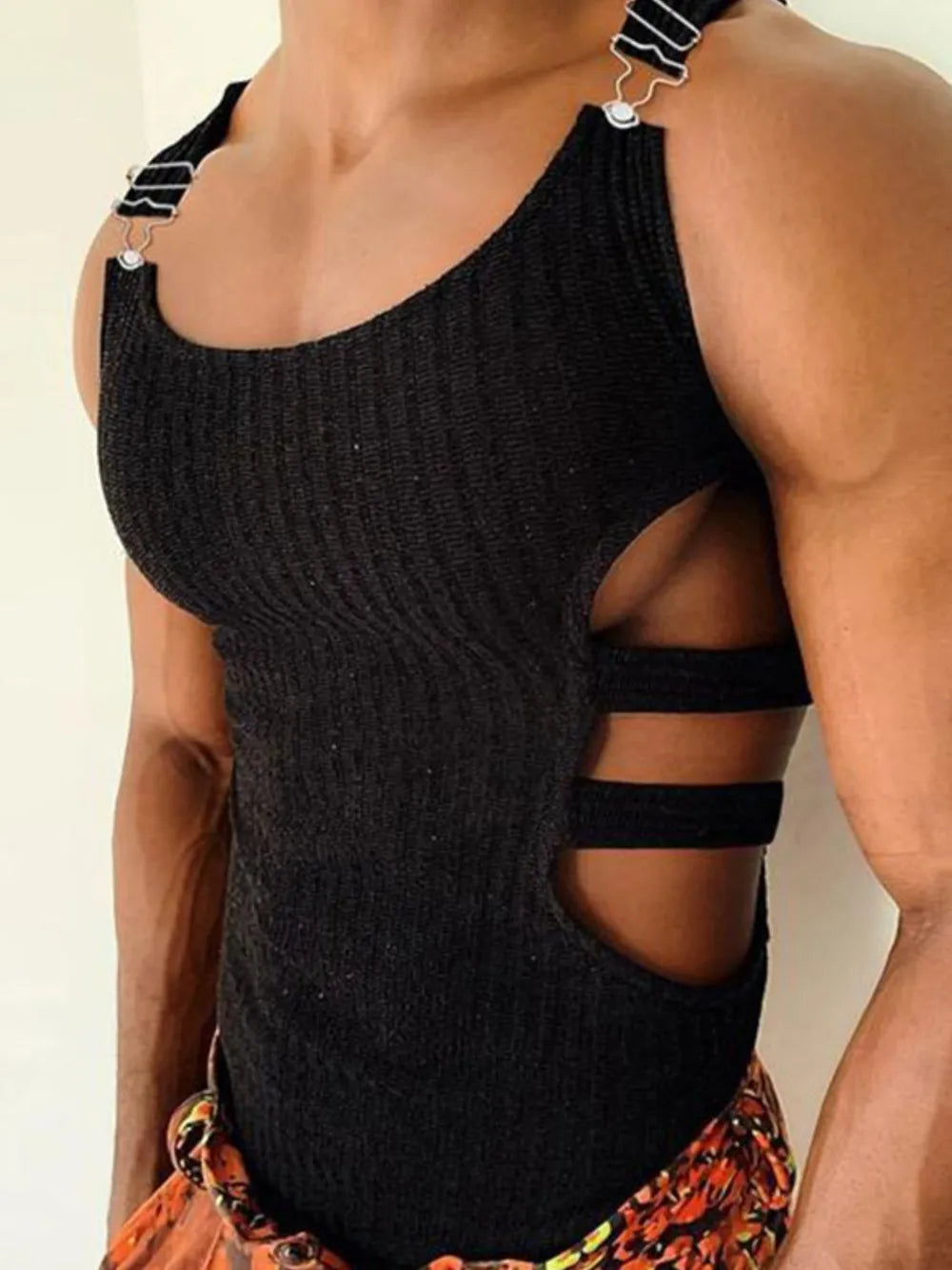 Black ribbed tank top with cutout sides and metal strap details