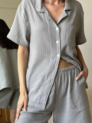 Gray cotton relaxed fit button-up shirt and shorts pajama set with collared neckline.