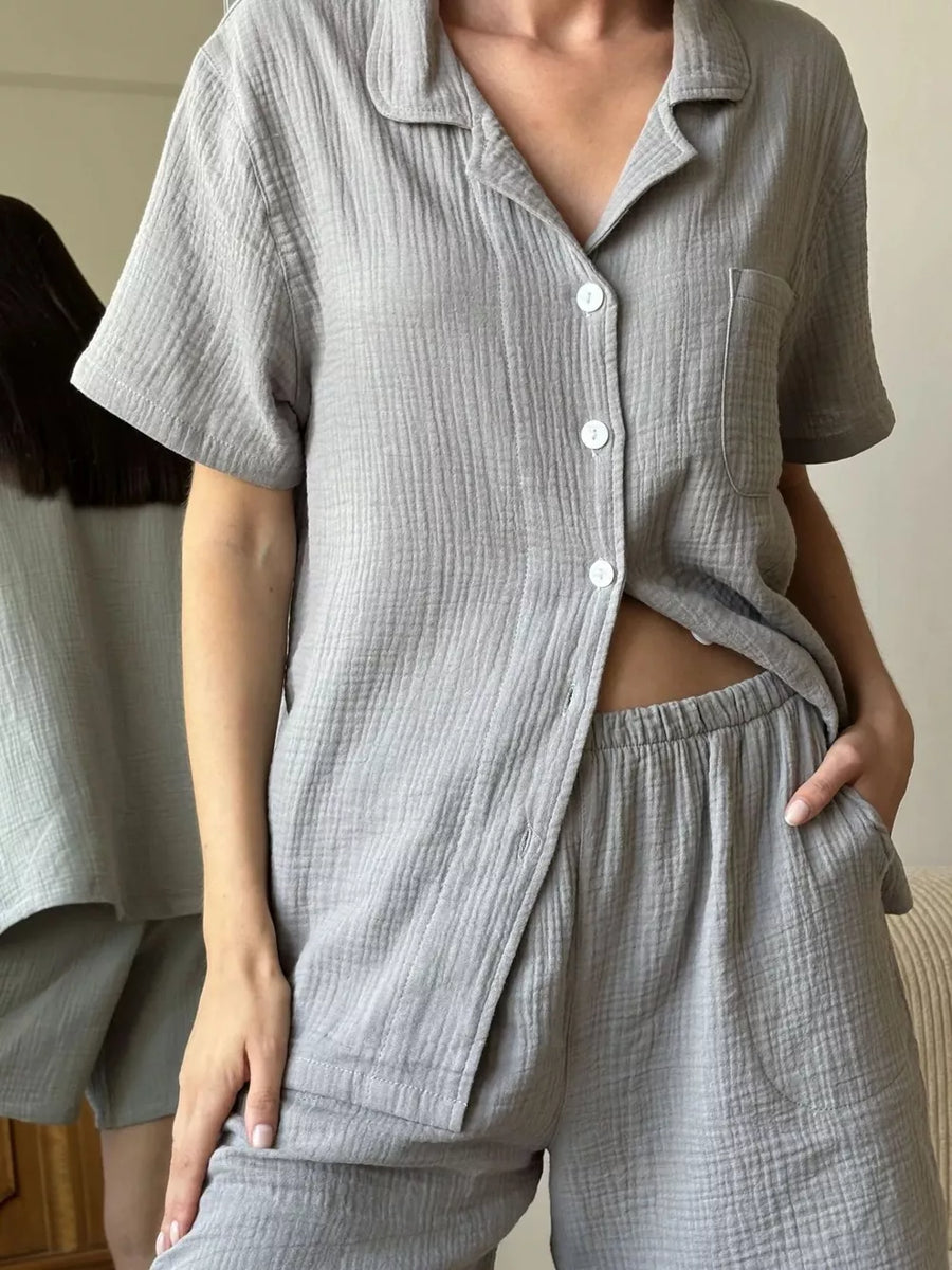 Gray cotton relaxed fit button-up shirt and shorts pajama set with collared neckline.