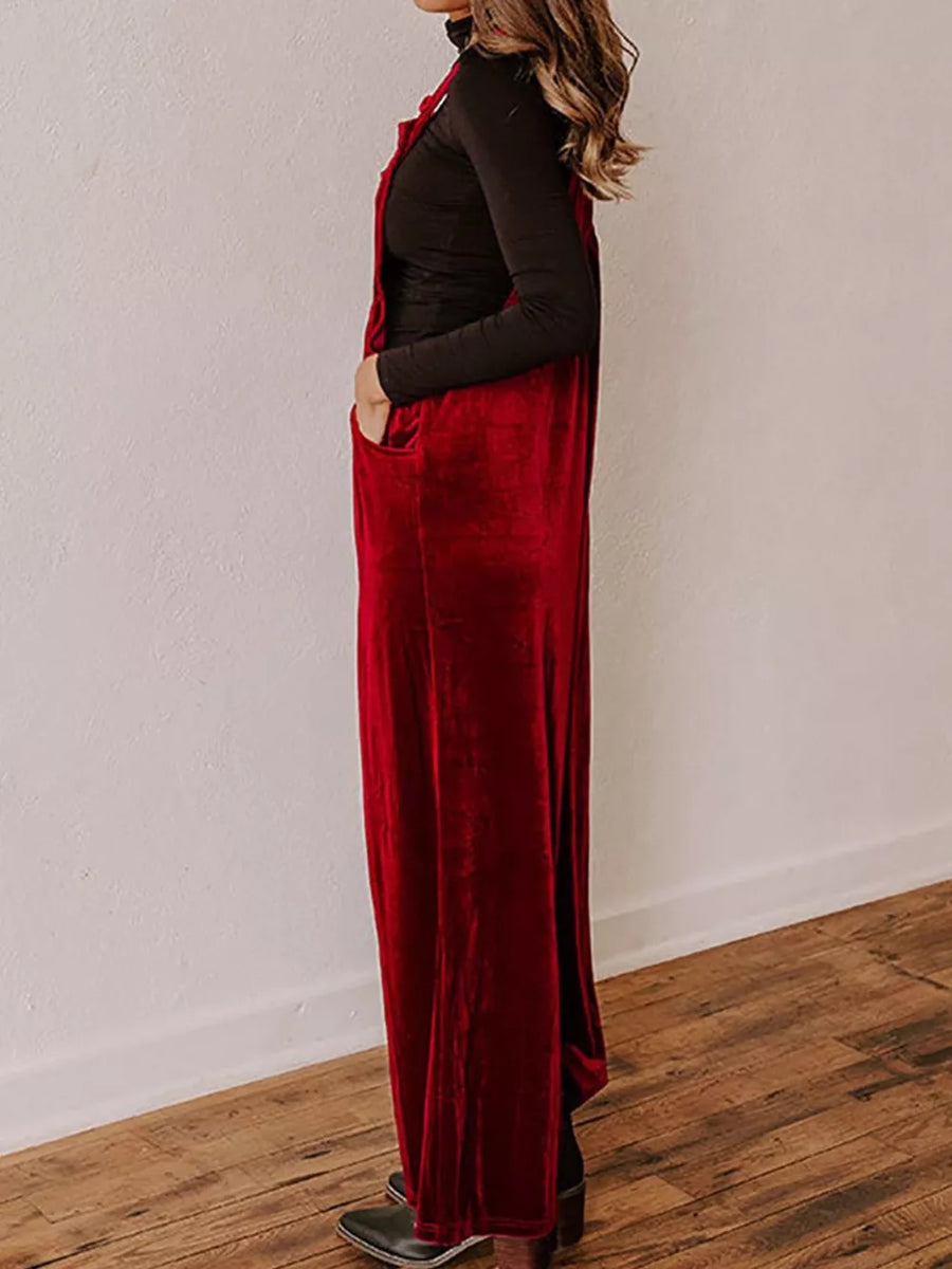 Burgundy velvet wide-leg maternity romper with pockets, styled with a black top.