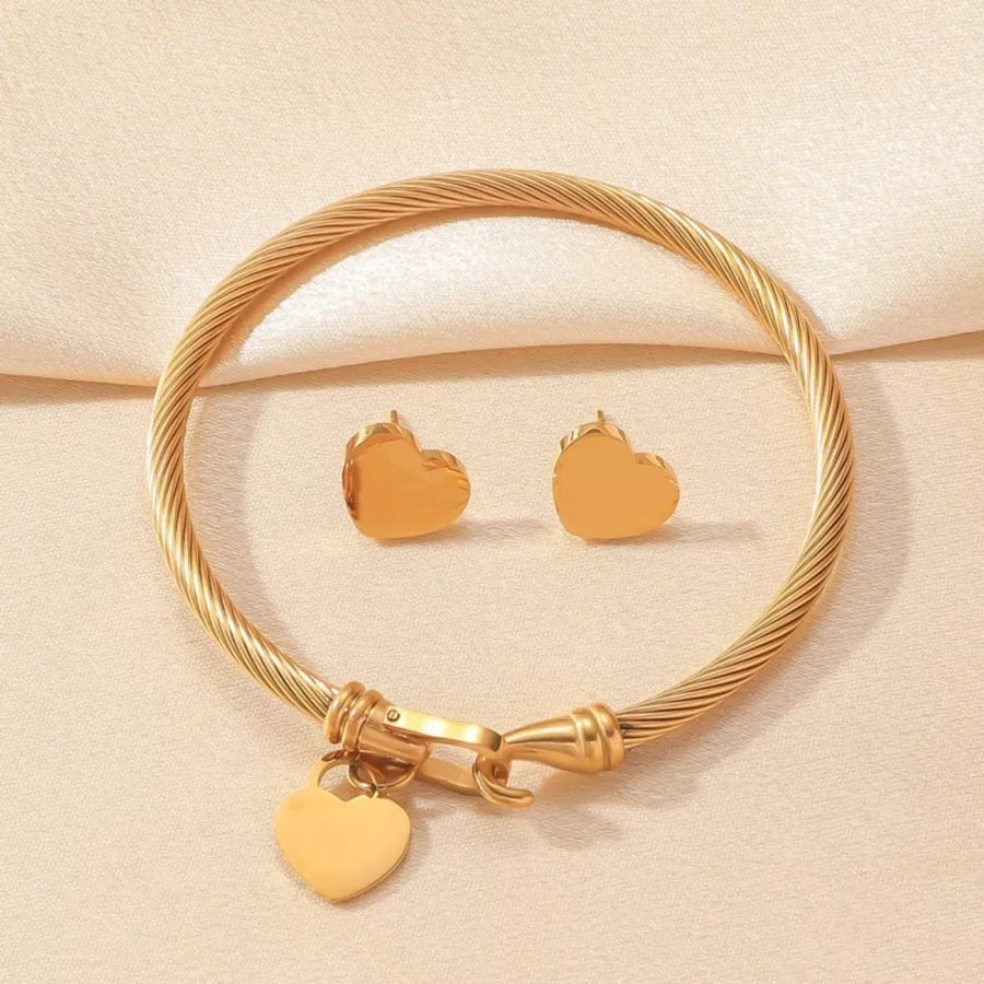 Gold jewelry set featuring heart motif and heart motif