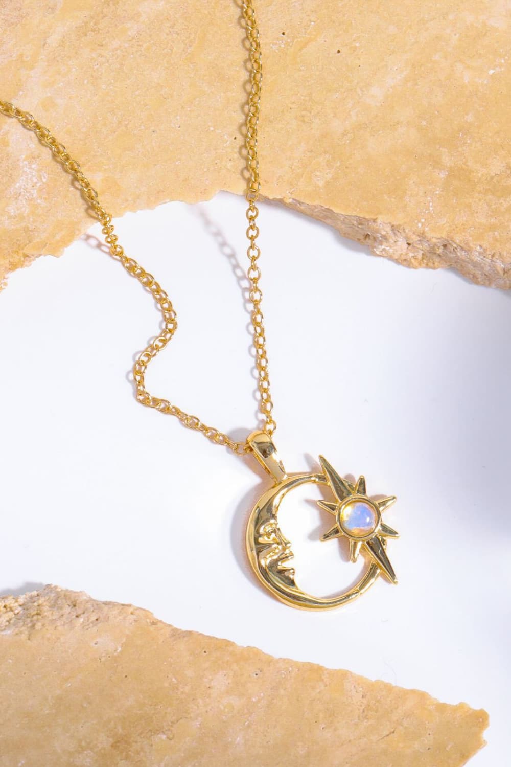 Gold celestial crescent moon and starburst necklace with opal detail