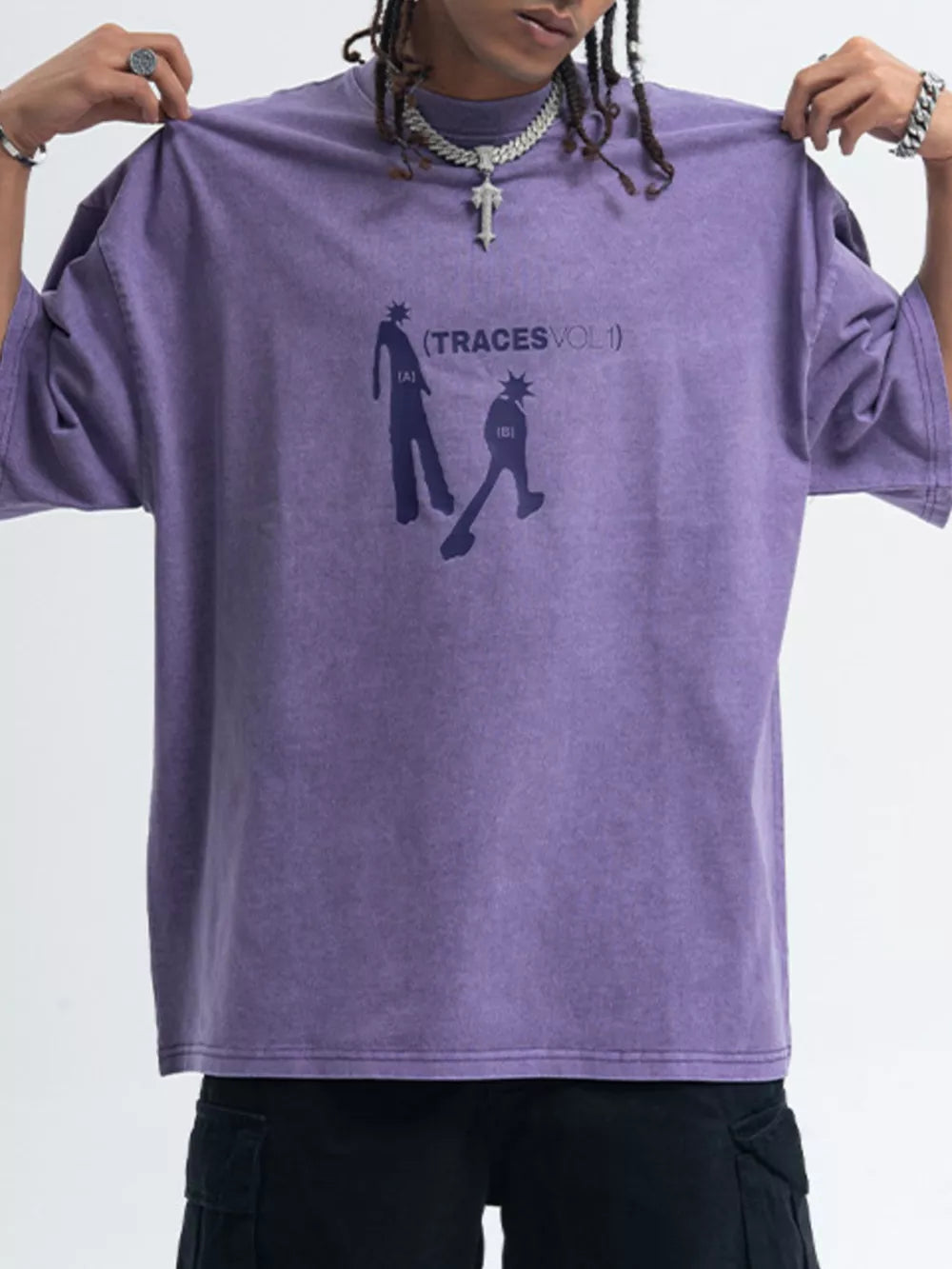 Purple oversized graphic tee with relaxed fit, crewneck, short sleeves, and cotton fabric.