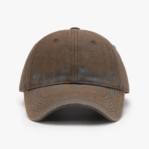 Textured denim baseball cap in Coffee Brown with faded blue graphic text.