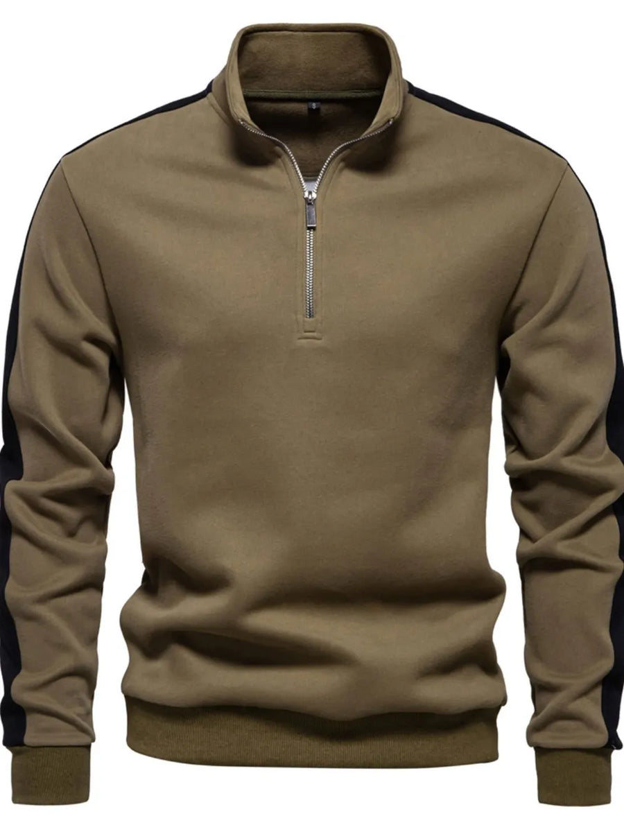 Quarter-zip sweatshirt in taupe with black side panels and a stand-up collar.