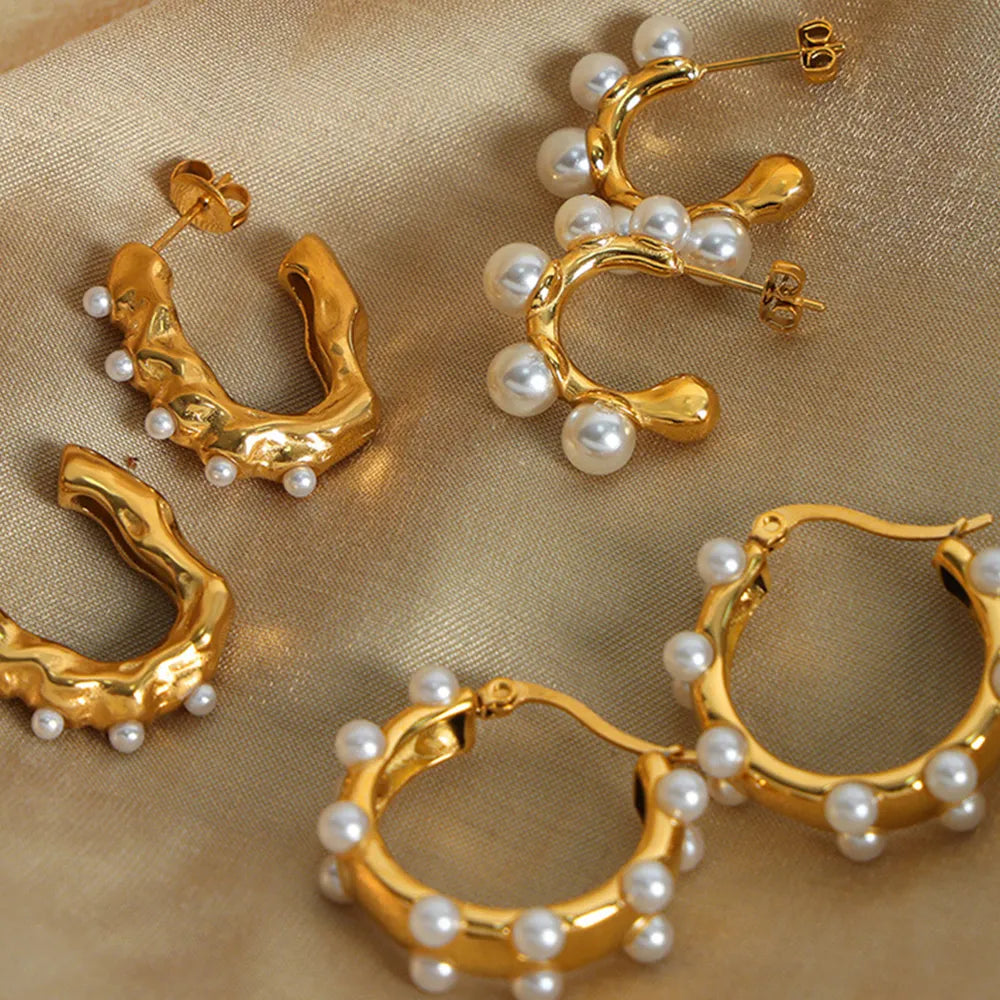 Gold hoop earrings with sculpted details and scattered pearls, available in multiple styles.