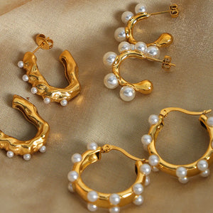 Gold hoop earrings with sculpted details and scattered pearls, available in multiple styles.