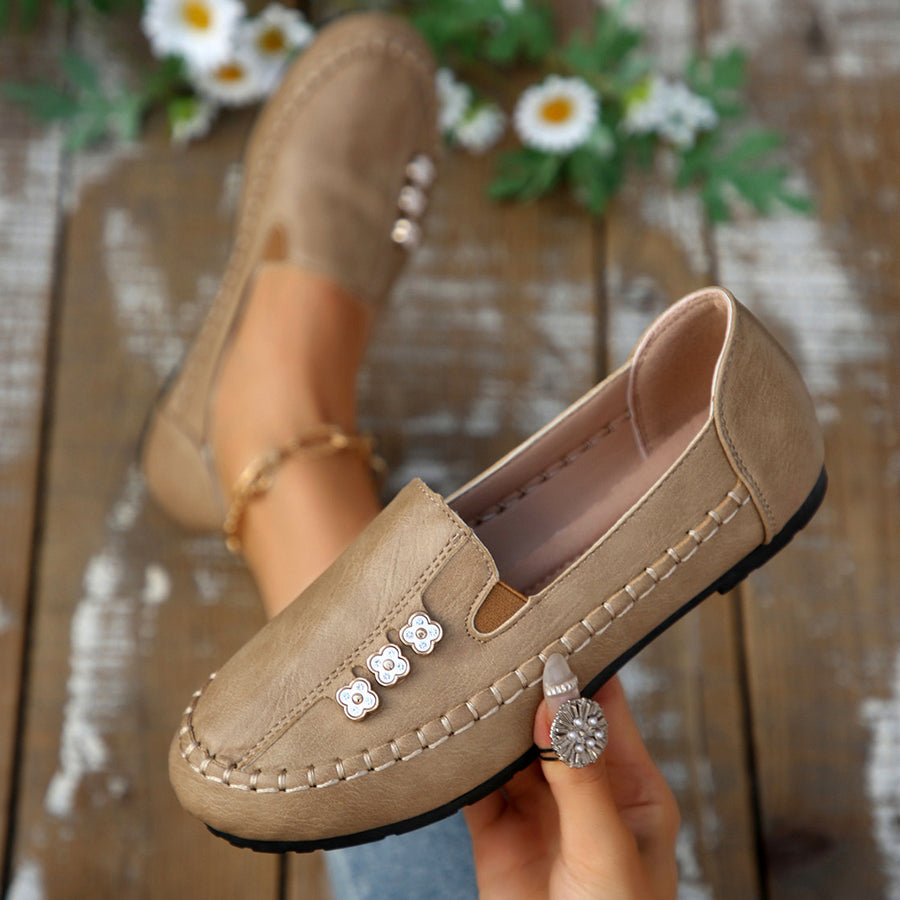 Round Toe Slip-Ons Style 10600196178 in navy blue with decorative stitching