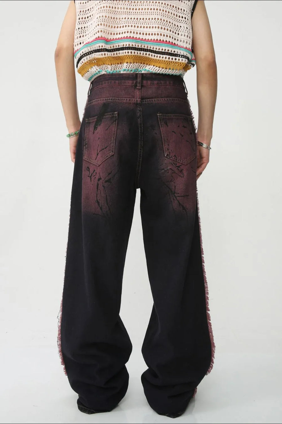 Distressed wide-leg jeans in mocha with frayed trim and a washed effect.
