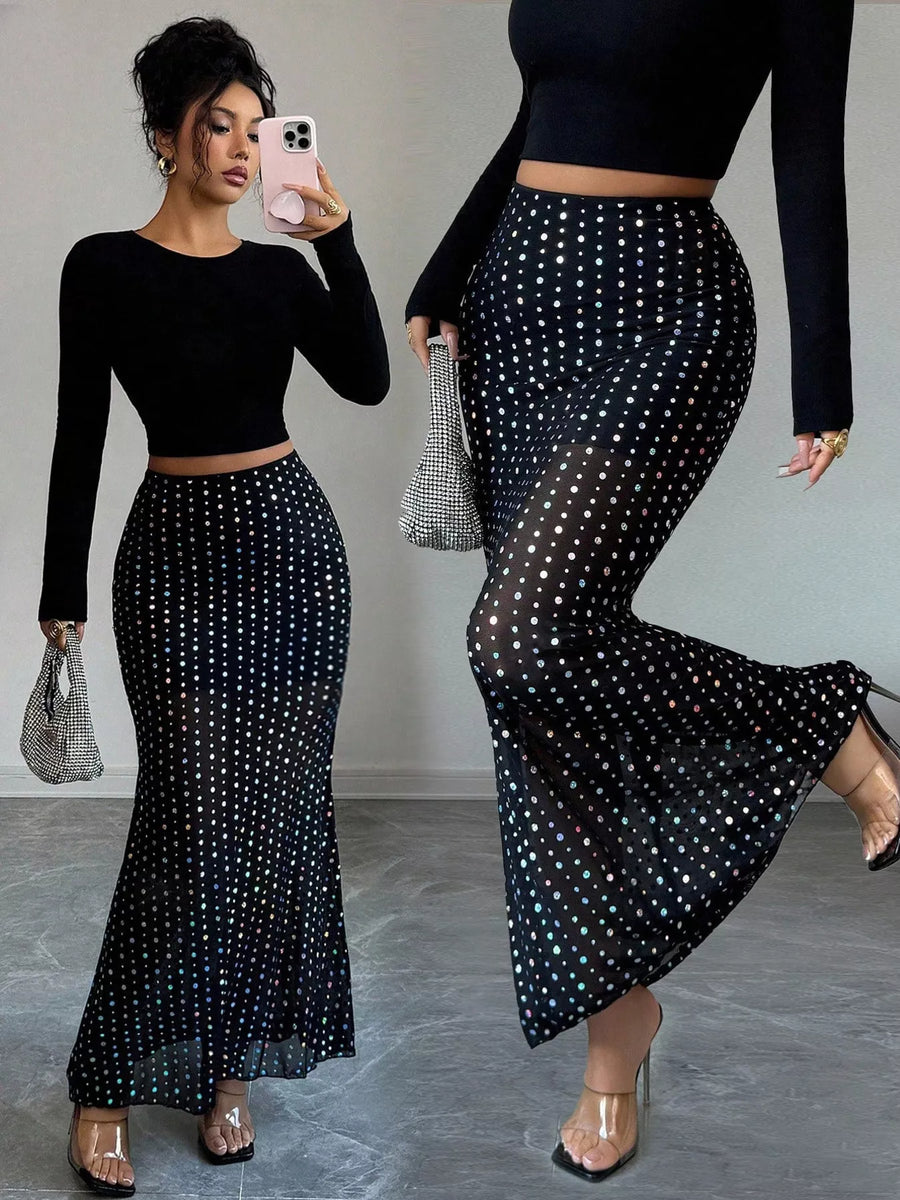 Black sheer polka dot maxi skirt with a mermaid hem.