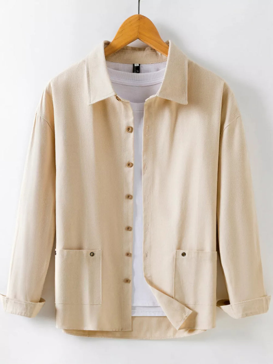 Khaki long sleeve button-up shirt with two chest pockets and a white t-shirt underneath.