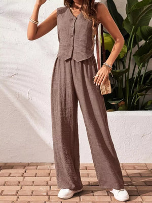 Taupe buttoned cropped vest and wide-leg pants set with textured fabric.
