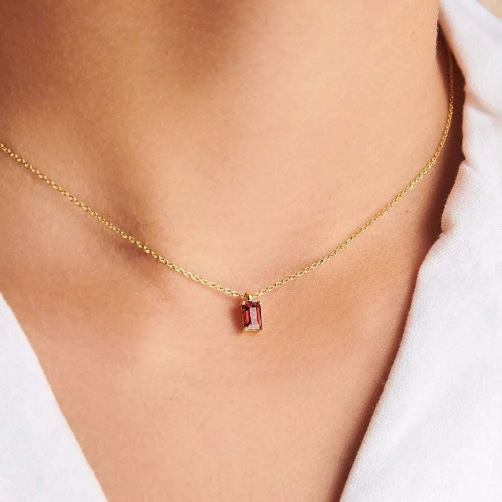 18K gold necklace with a rectangular red gemstone pendant