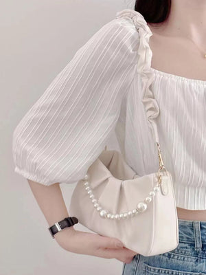 Beige ruched shoulder bag with pearl strap detail