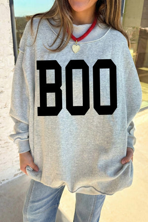 black mock neck sweater featuring reversible and bat-print