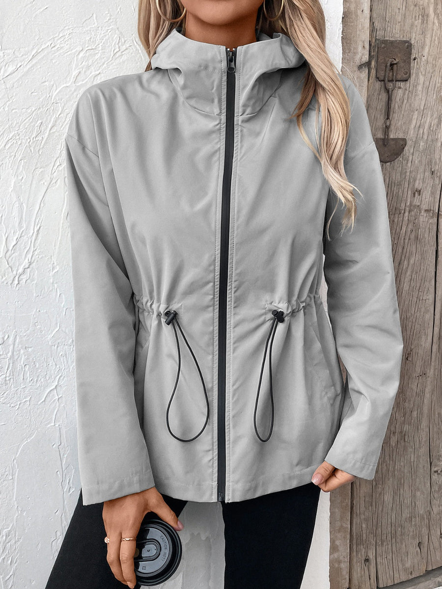 Gray hooded utility jacket with cinched waistline and black zipper
