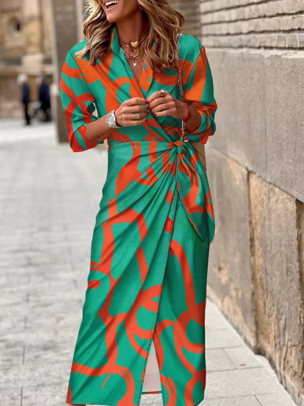 Green abstract patterned shirt dress with 3/4 sleeves and a waist tie detail.