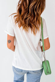 White VIBE VIBRATIONS graphic tee with rolled sleeves and an eye tattoo on the arm.