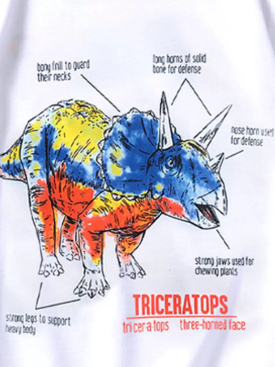 White t-shirt with a colorful Triceratops dinosaur graphic and educational text labels.