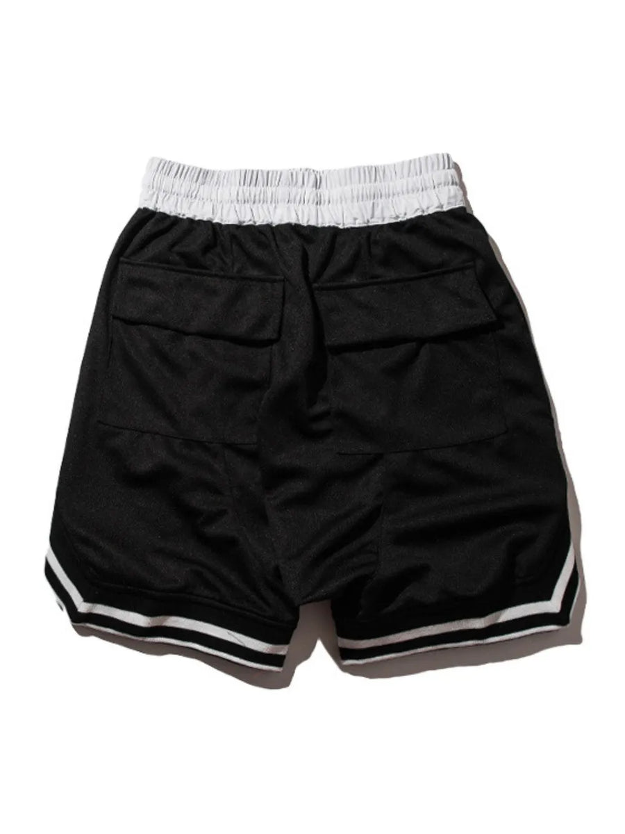 Black mesh basketball shorts with white drawstring and striped trim.