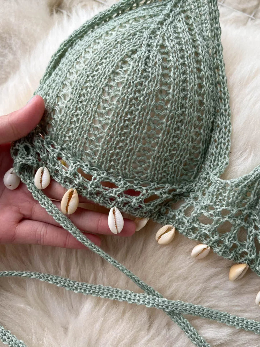 Green crochet halter bikini top with shell trim and tie straps.
