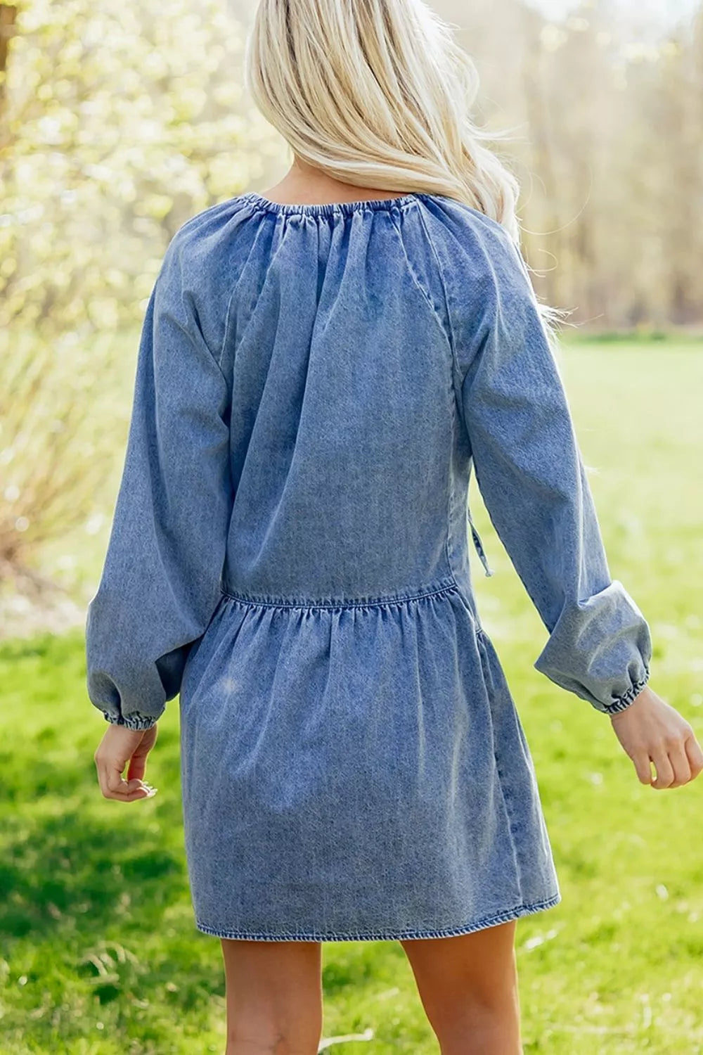 85% cotton, 15% polyester Care instructions: Machine wash cold mini dress in medium wash denim blue with loose silhouette