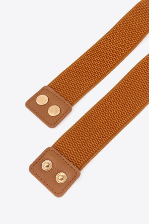Ochre elastic belt with brown faux leather tabs and gold hardware detail