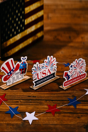 Patriotic wooden tabletop decor with USA, Independence Day, and Happy 4th July designs.