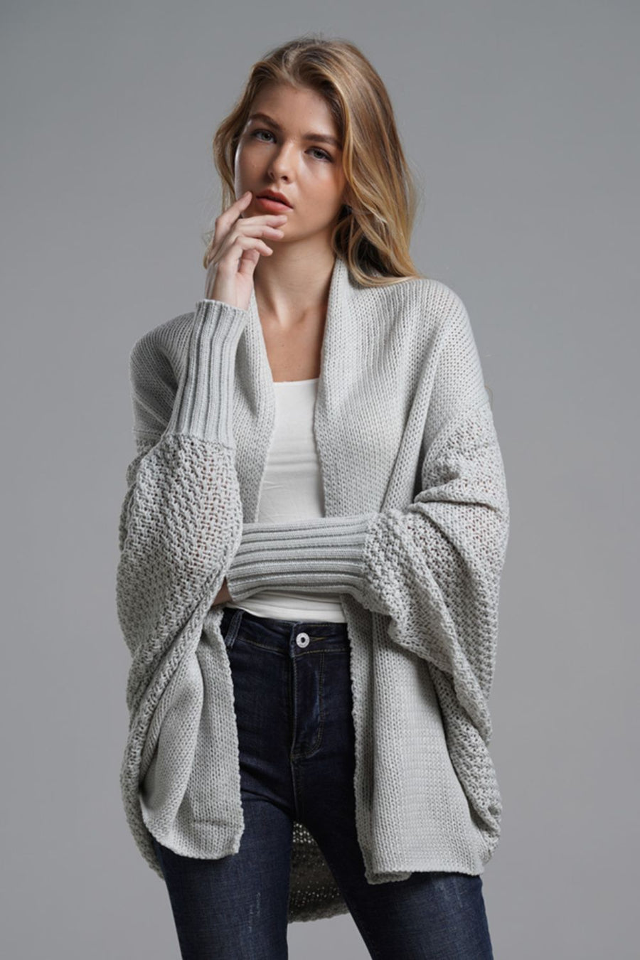 Gray acrylic batwing cardigan with textured sleeves and drape front.