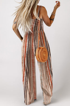 Striped square neck wide-leg romper with adjustable straps and a woven round crossbody bag.