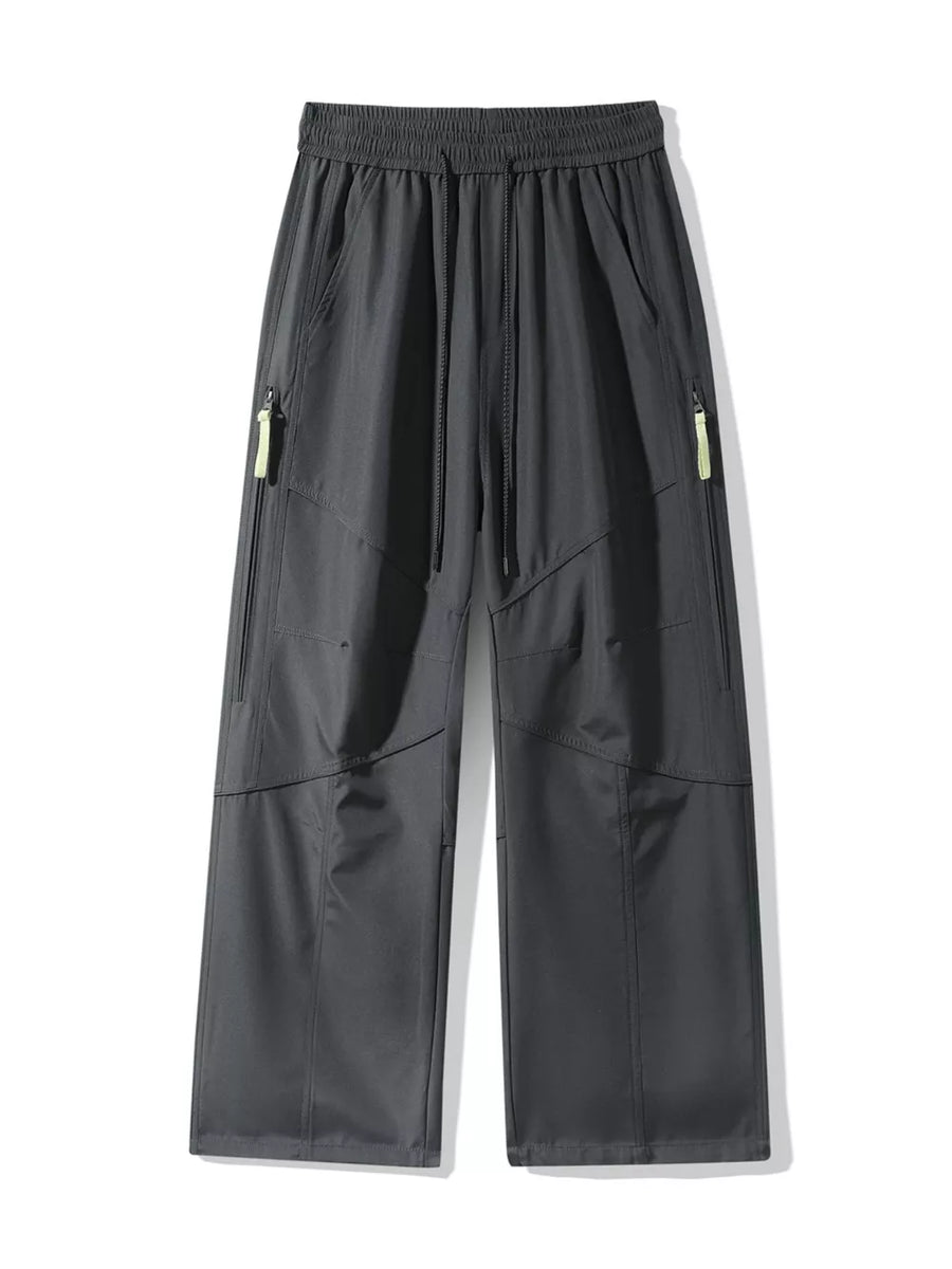 Men's gray loose fit cargo pants with drawstring and zip pockets.