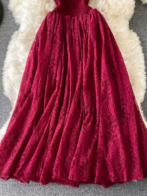 Red lace maxi dress with ruffled detail and cutout neckline.