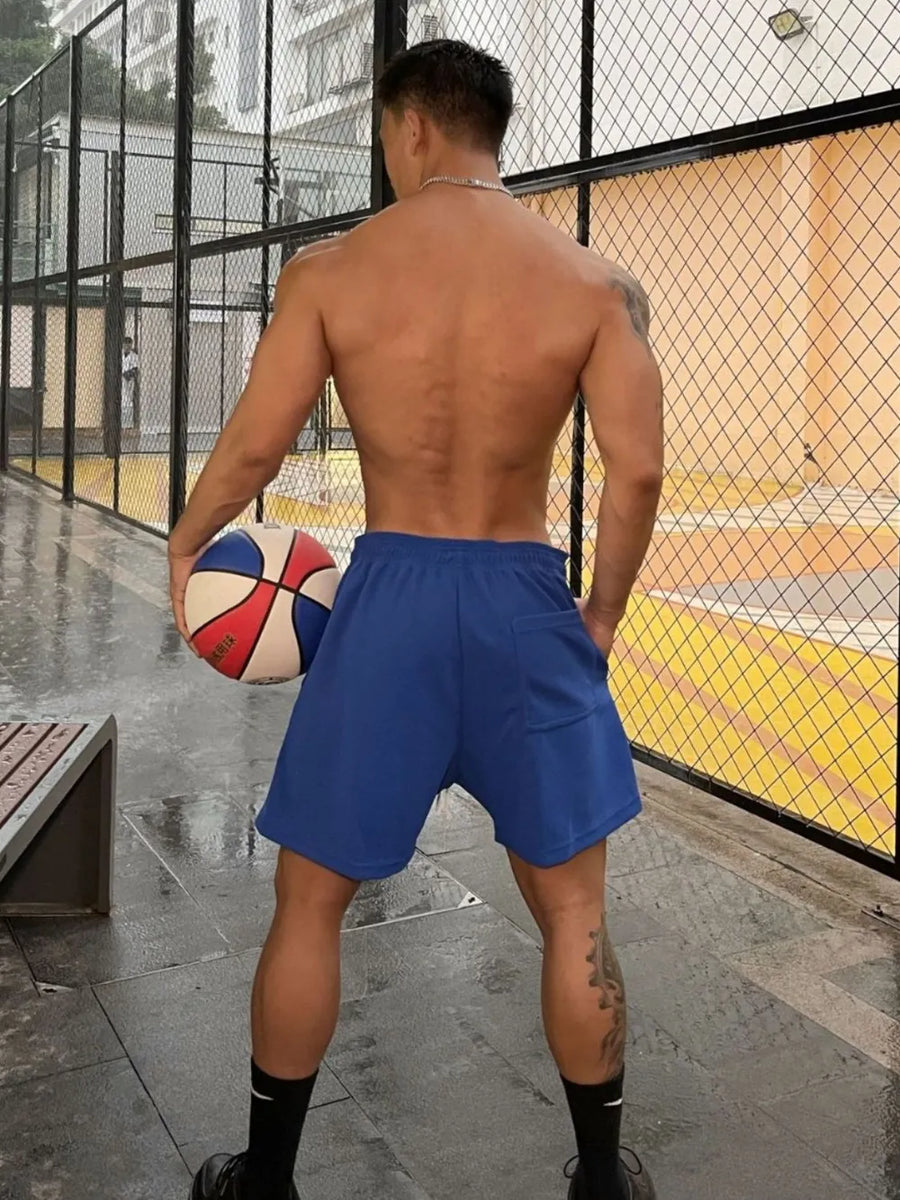 Athletic drawstring lounge shorts in royal blue with a back pocket.